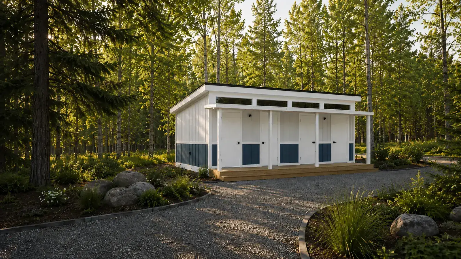 White Pine mobile bathhouse with a porch on a wooded gravel pad