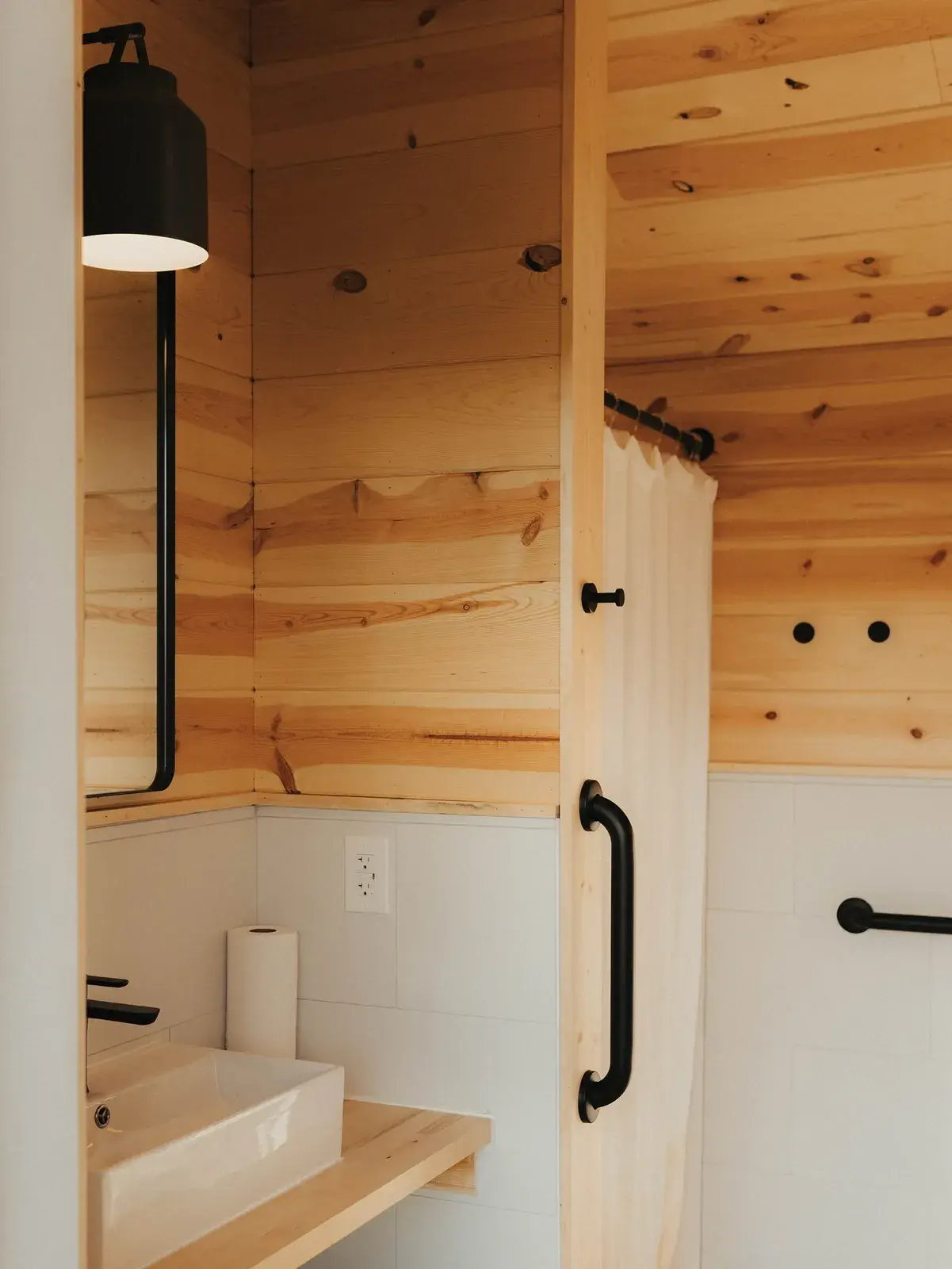 Wood-lined interior with black fixtures